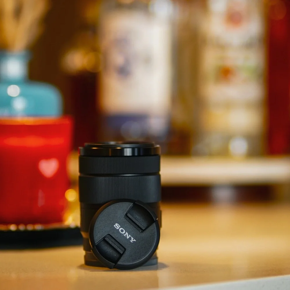 Sony E 18-135mm F3.5-5.6 OSS w/lens hood.